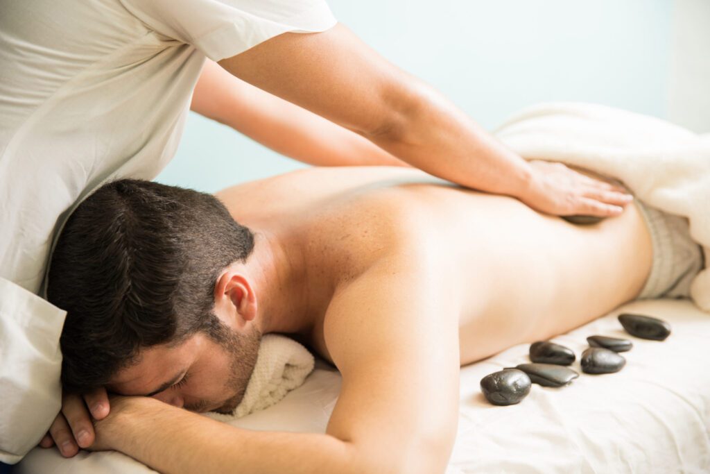 Hot stone massage at a spa Best Russian Spa In Aerocity | Spa In Aerocity & Book Now High Profile 09211465759